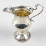 A George III silver cream jug,