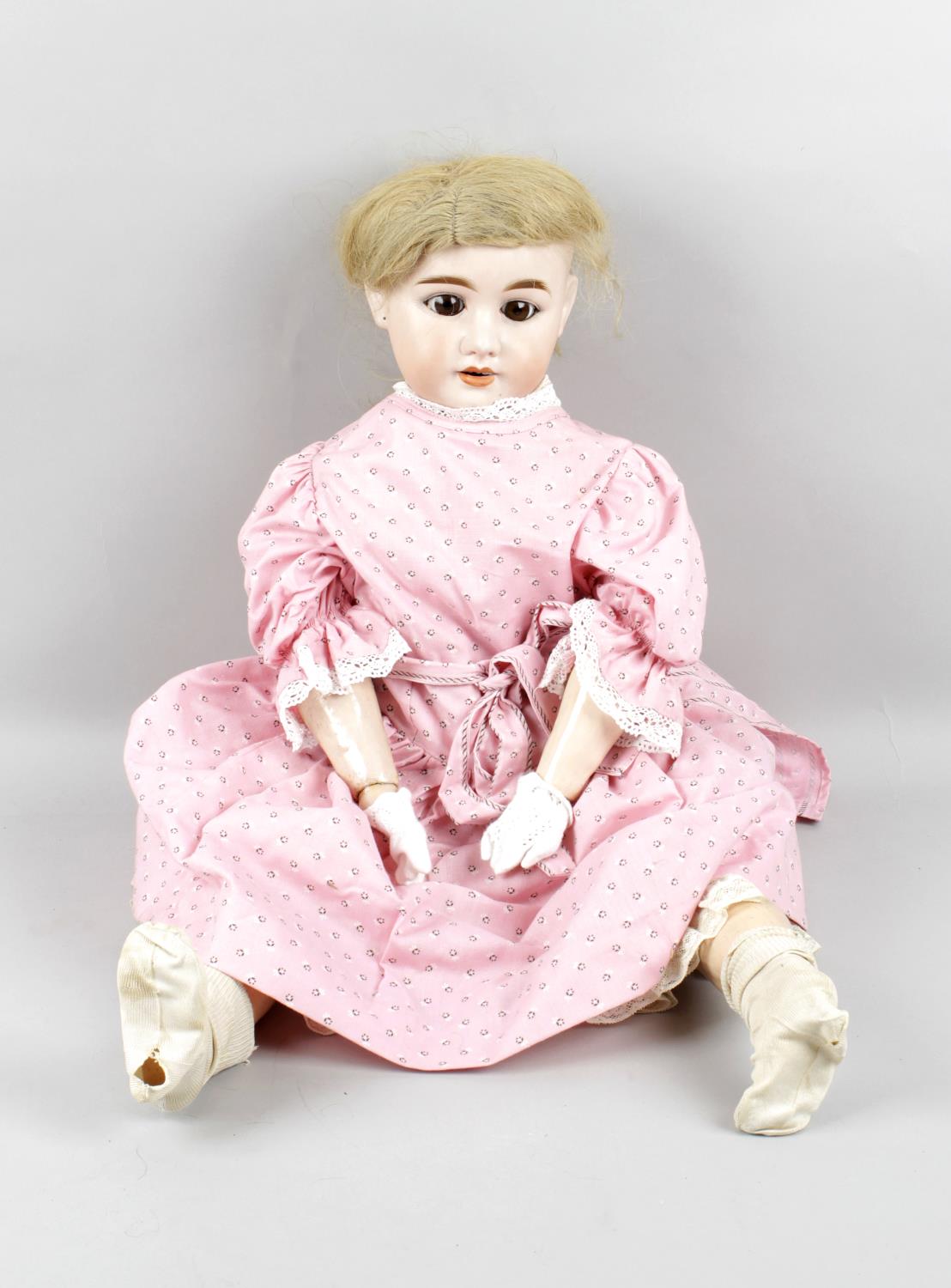 An Olympia bisque headed doll,