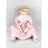 An Olympia bisque headed doll,