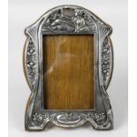 An Edwardian silver mounted photograph frame,