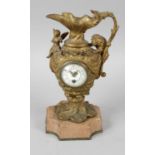 A late 19th century gilt metal novelty desk clock modelled as a ewer,