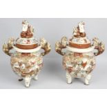 A pair of late 19th/early 20th century pottery koros and covers,