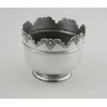 An Edwardian silver planter of circular form,