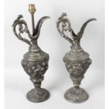 A pair of reproduction cast metal table lamps,