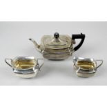 An Edwardian silver three piece bachelor tea service,