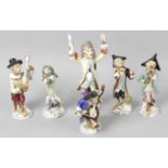 A set of six monkey bandsmen figurines,