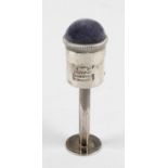 A sterling silver mounted pin cushion and cotton reel holder,