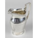 A 1920's silver cream or milk jug,