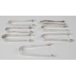 Six pairs of George III silver sugar tongs,