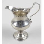 A George III silver cream jug by Hester Bateman,