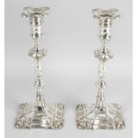 A pair of Edwardian silver candlesticks in mid-eighteenth century Georgian style,