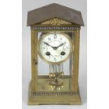 An early 20th century gilt metal and champlevé enamel mantel clock,