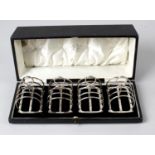 A 1930's set of four small silver toast racks,