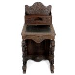 A late 19th century Anglo Indian carved hardwood davenport,