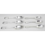 A mid-Victorian silver set of twelve table spoons and twelve matching dessert spoons,