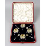 A cased mid-Victorian silver set of four open salts and spoons,