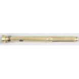 A yellow metal propelling pencil,