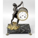 A cast metal mantel clock,