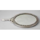 A large continental handheld mirror,