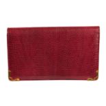 CARTIER - a lizard skin clutch.