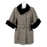 ARMANI COLLEZIONI - a three quarter-length virgin wool coat with fur trim.