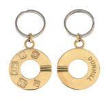 DUNHILL - a pair of 9ct gold keyrings.