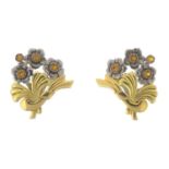 A pair of sapphire floral earrings.