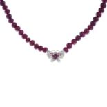 A ruby and diamond necklace.