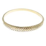 A 9ct gold diamond hinged bangle.