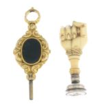 A mid Victorian gem-set watch key and fob.