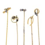 Five early 20th century gold stickpins.