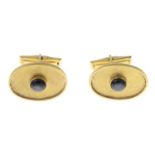 A pair of 14ct gold star sapphire cufflinks.