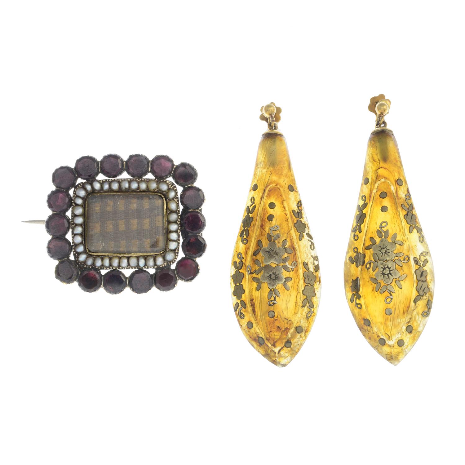 A late Victorian memorial brooch and a pair of late Victorian tortoiseshell drop earrings.