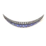 A late Victorian silver and 9ct gold, sapphire and diamond crescent brooch.