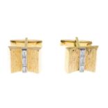 A pair of diamond cufflinks.