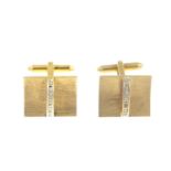 A pair of diamond cufflinks.