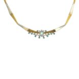 An 18ct gold emerald and diamond necklace.