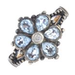 A diamond and topaz cluster ring.