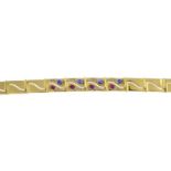 An 18ct gold diamond and gem-set bracelet.