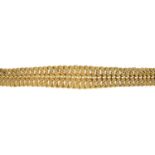 A bracelet. Designed as a series of textured links, to the partially concealed push-piece clasp.