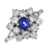 A sapphire and diamond cluster ring.