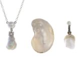 Two diamond and cultured pearl pendants and a loose blister pearl.