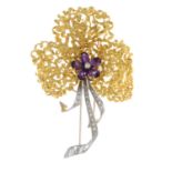 A mid 20th century gold amethyst and diamond brooch.