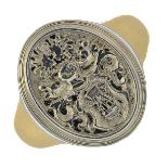 A signet ring. Designed as an oval panel, engraved to depict a crest, with tapered band.