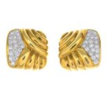 A pair of diamond earrings.