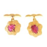 A pair of ruby cufflinks.