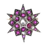 An early 20th century silver and gold ruby and diamond brooch.