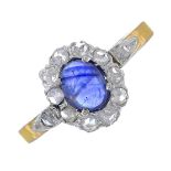 A sapphire and diamond cluster ring.