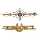 Two brooches. To include a late Victorian 9ct gold floral motif horseshoe brooch,