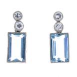 A pair of aquamarine and diamond earrings.